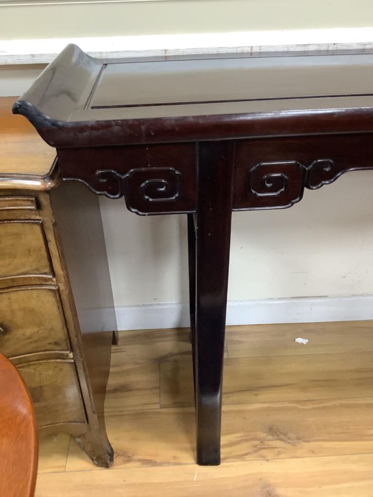 A 20th century Chinese hardwood altar table, width 150cm depth 40cm height 86cm